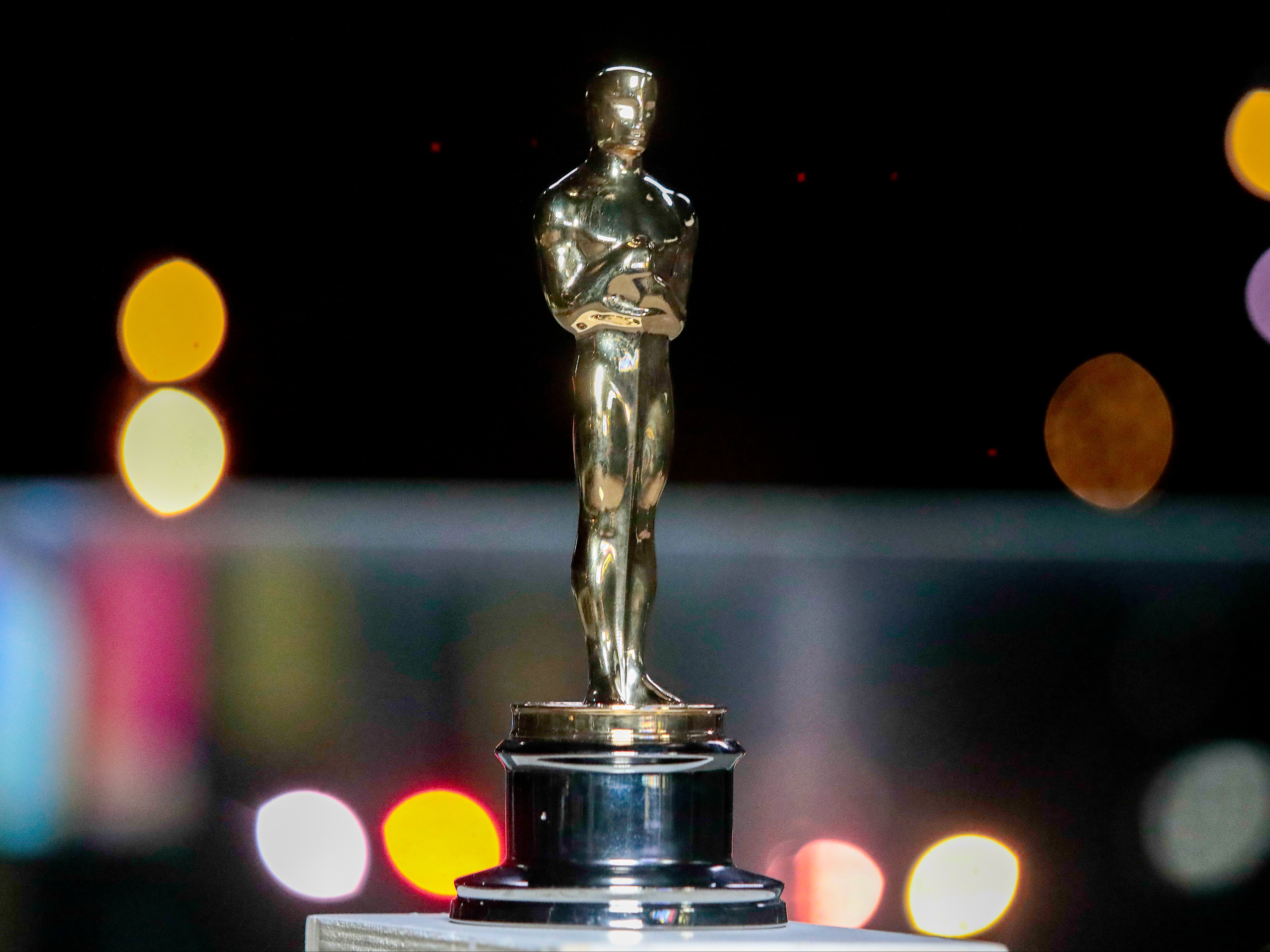 An Oscar statue is seen during a screening of the Oscars on 26 April 2021 in Paris, France
