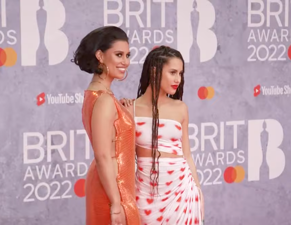 Raye with her sister Abby on the Brits red carpet