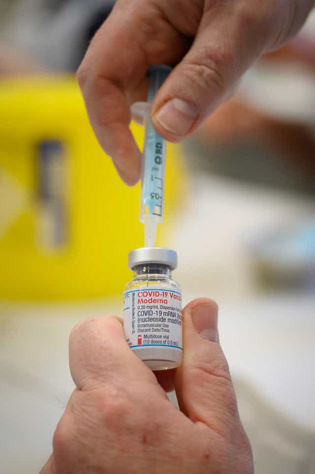 Medical staff and volunteers prepare shots of the Moderna Covid-19 vaccine (Leon Neal/PA)
