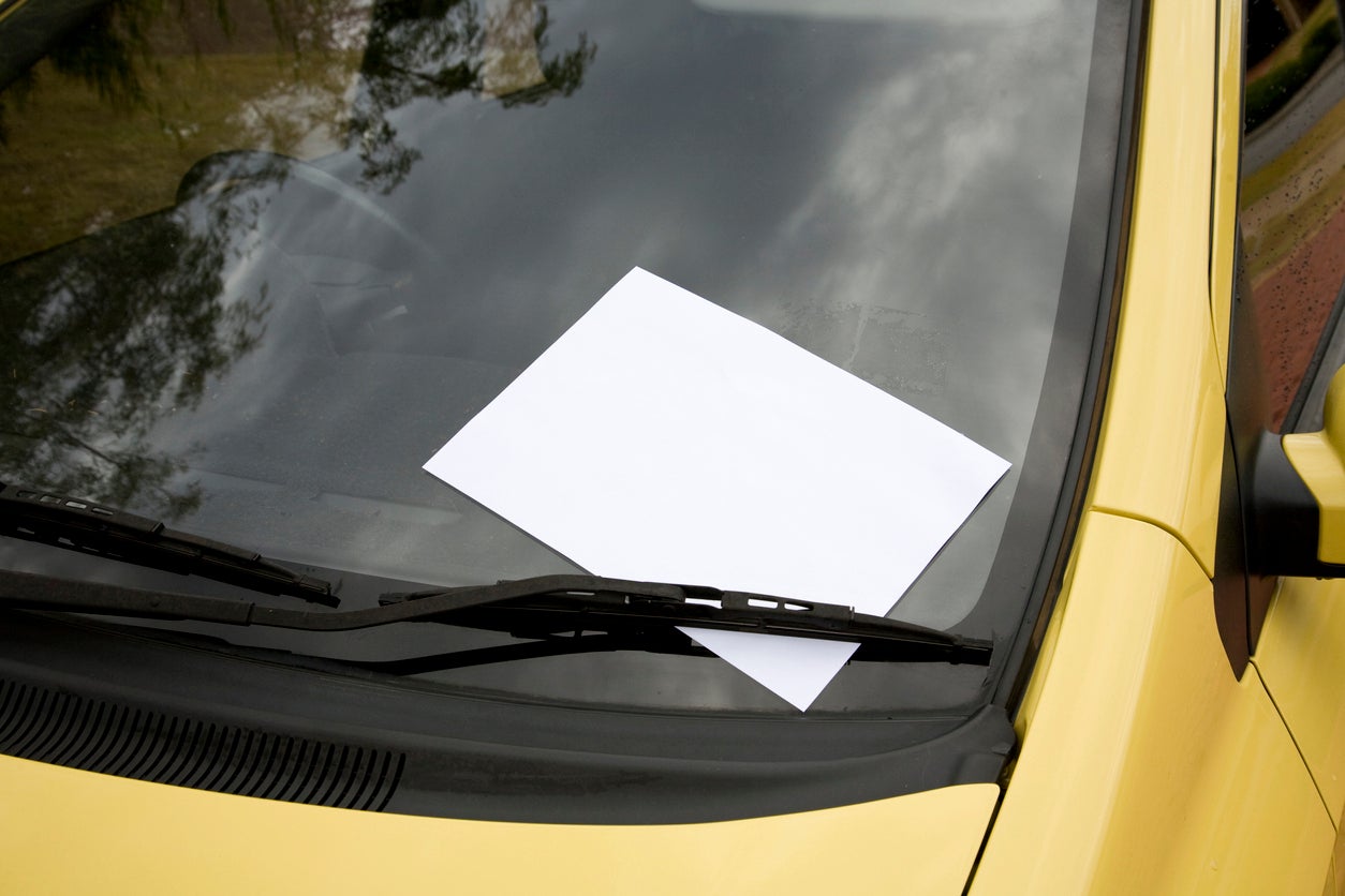 Notes were left around the neighbourhood including on car windshields (illustration)