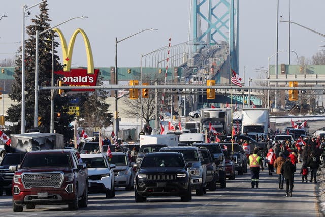 <p>Vehicles block the route leading from the Ambassador Bridge, linking Detroit and Windsor, as truckers and their supporters continue to protest against Covid-19 vaccine mandates</p>