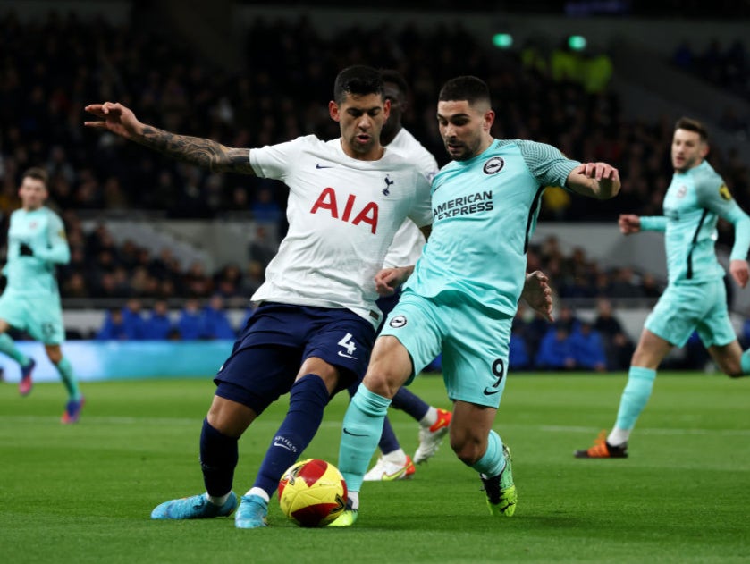 Cristian Romero tackles Brighton’s Neal Maupay