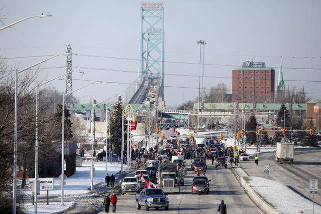 <p>Vehicles block the route leading from the Ambassador Bridge, linking Detroit and Windsor</p>