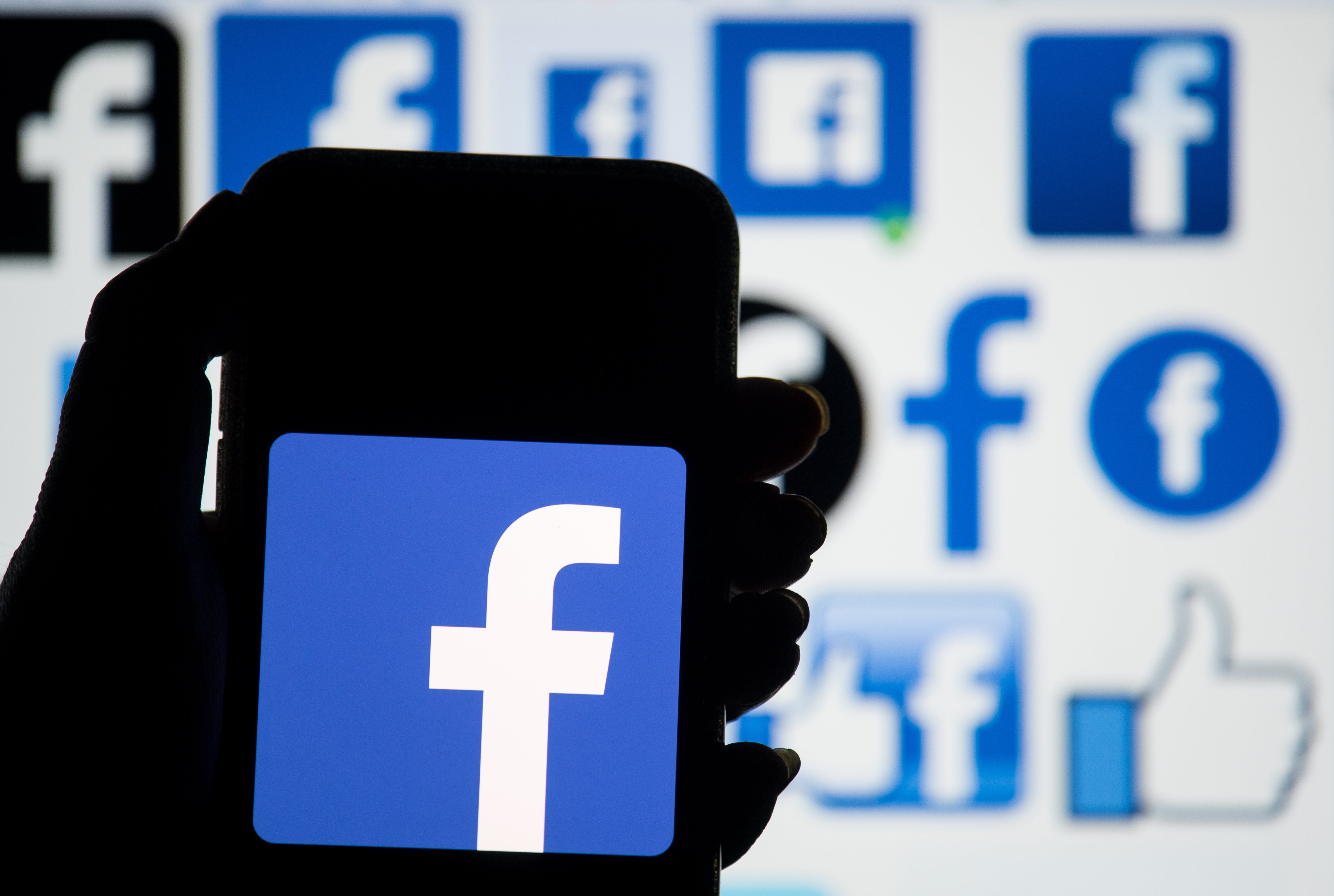 The logo of social networking site Facebook is displayed on a smartphone (Dominic Lipinski/PA)