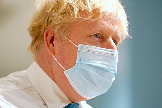 Boris Johnson has signalled that people who test positive for Covid will soon no longer have to isolate (PA)
