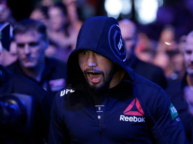 <p>Robert Whittaker makes his entrance ahead of his first fight with Israel Adesanya</p>