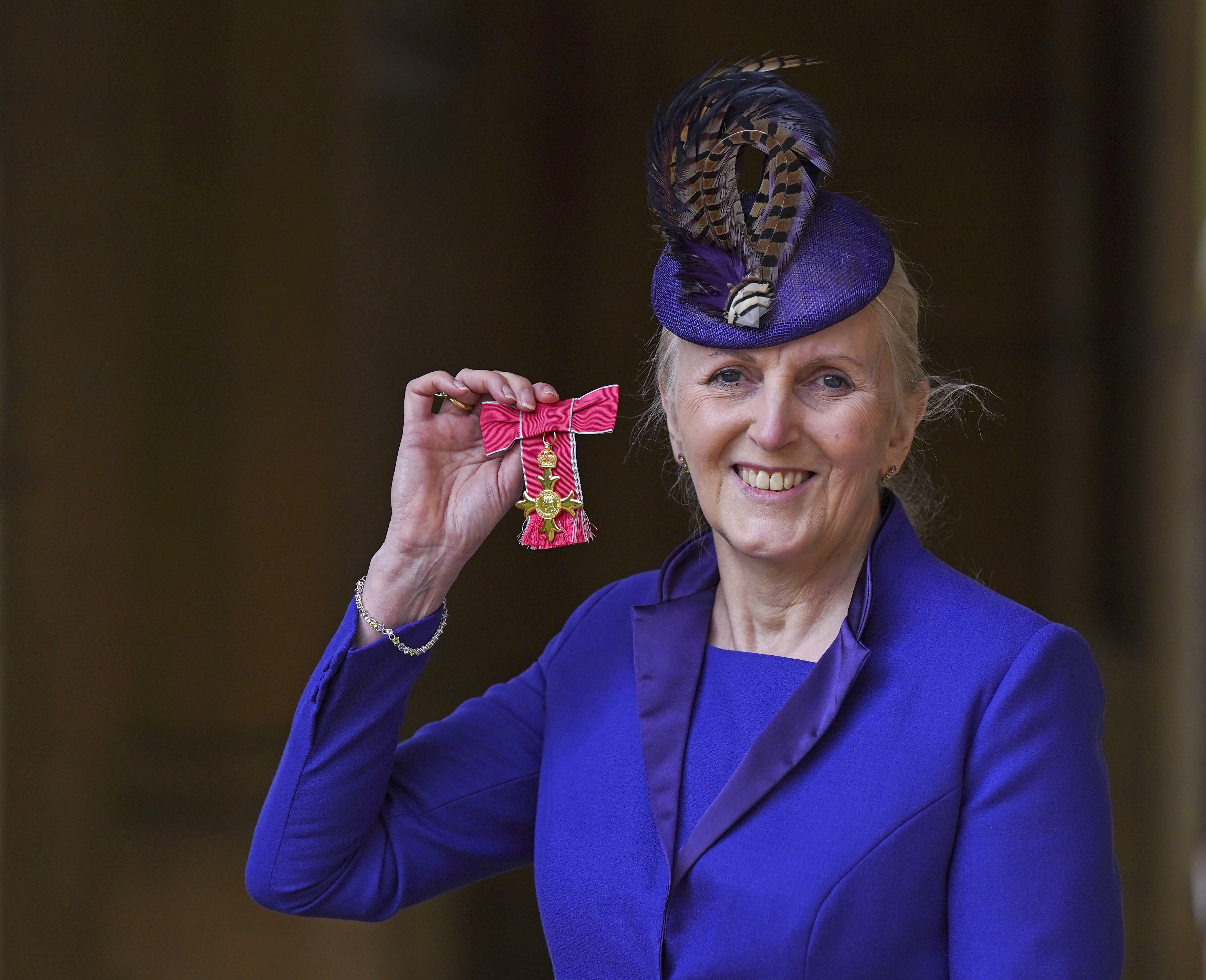 Angela Owen with her OBE (Steve Parsons/PA)