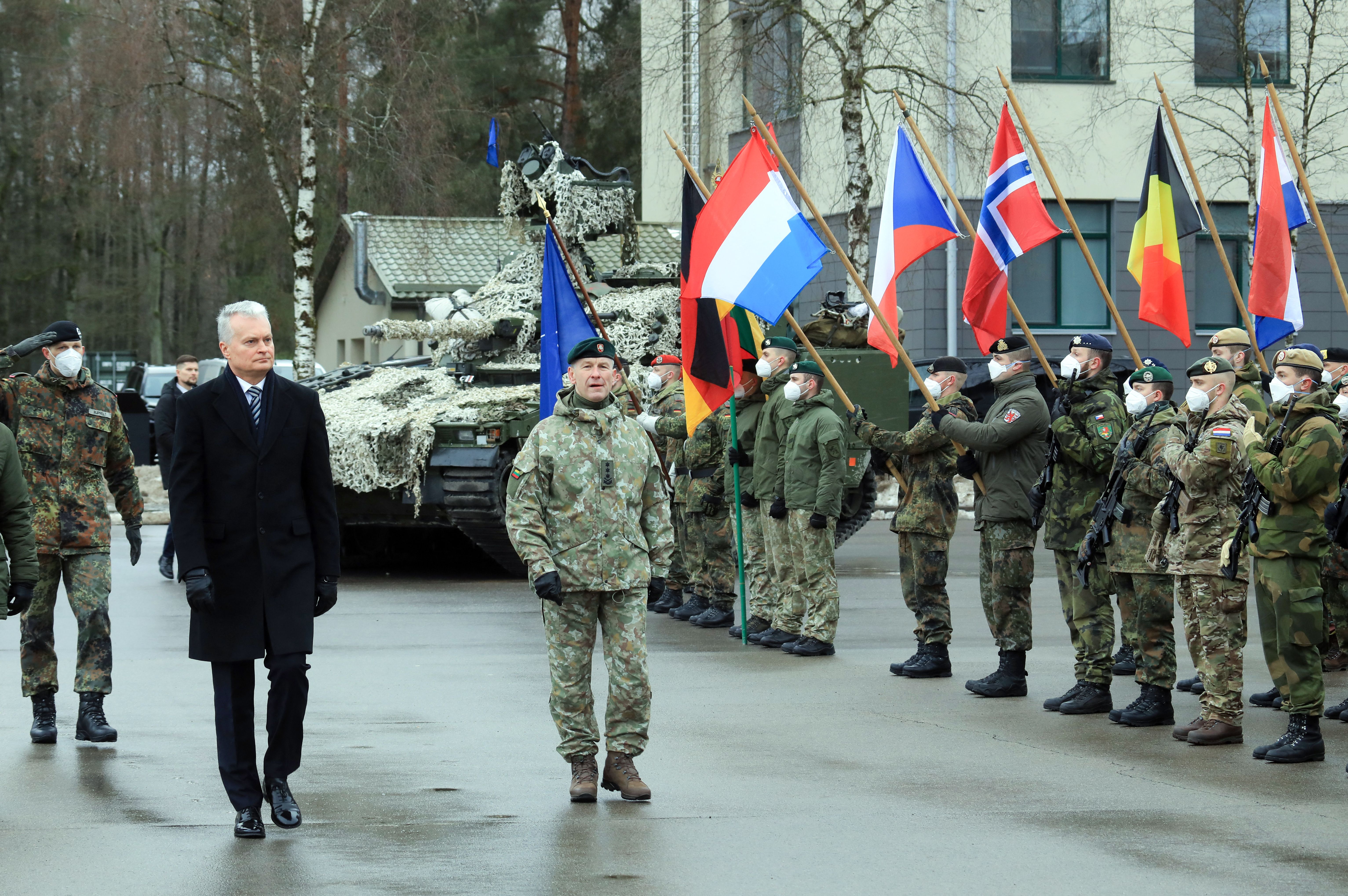 Lithuanian President Gitanas Nauseda (2ndL) takes part in an official ceremony marking the 5th anniversary of NATO’s enhanced Forward Presence in the eastern part of the Alliance in Rukla, Lithuania, on February 9, 2022.