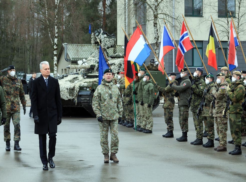 <p>Lithuanian President Gitanas Nauseda (2ndL) takes part in an official ceremony marking the 5th anniversary of NATO’s enhanced Forward Presence in the eastern part of the Alliance in Rukla, Lithuania, on February 9, 2022.</p>
