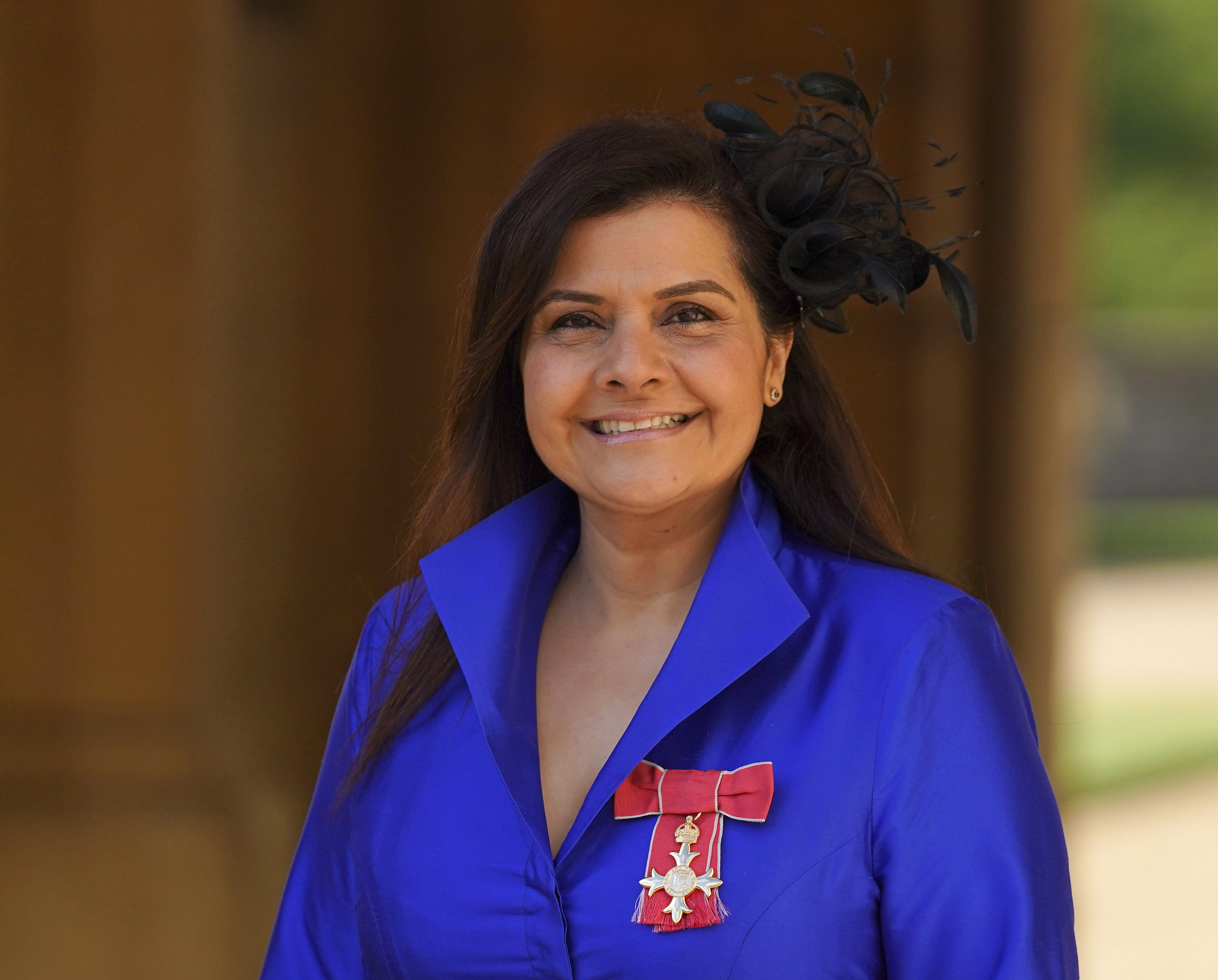Nina Wadia with her OBE (Steve Parsons/PA)