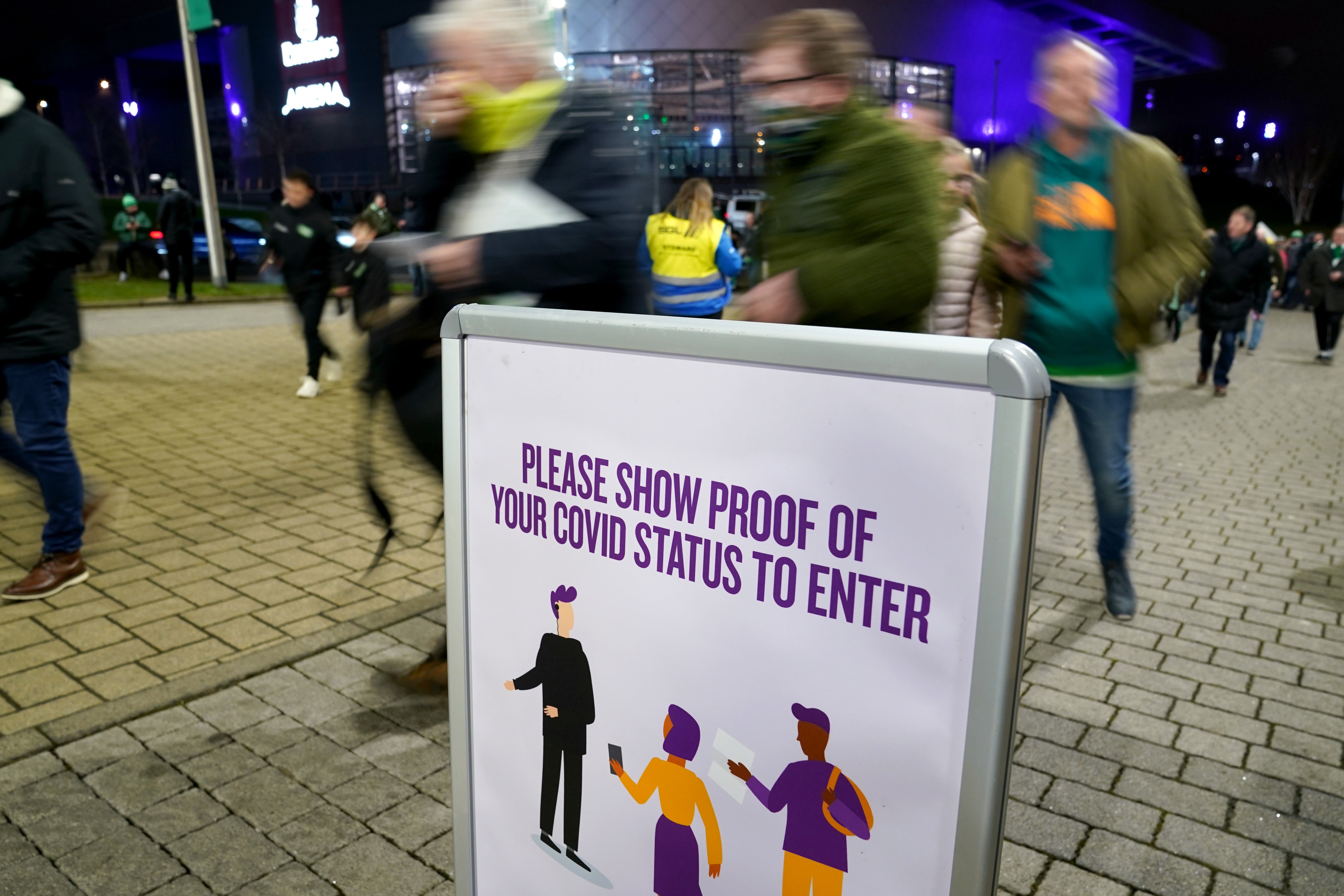 Celtic fans show Covid passes before a match at Celtic Park in Glasgow (Andrew Milligan/PA)