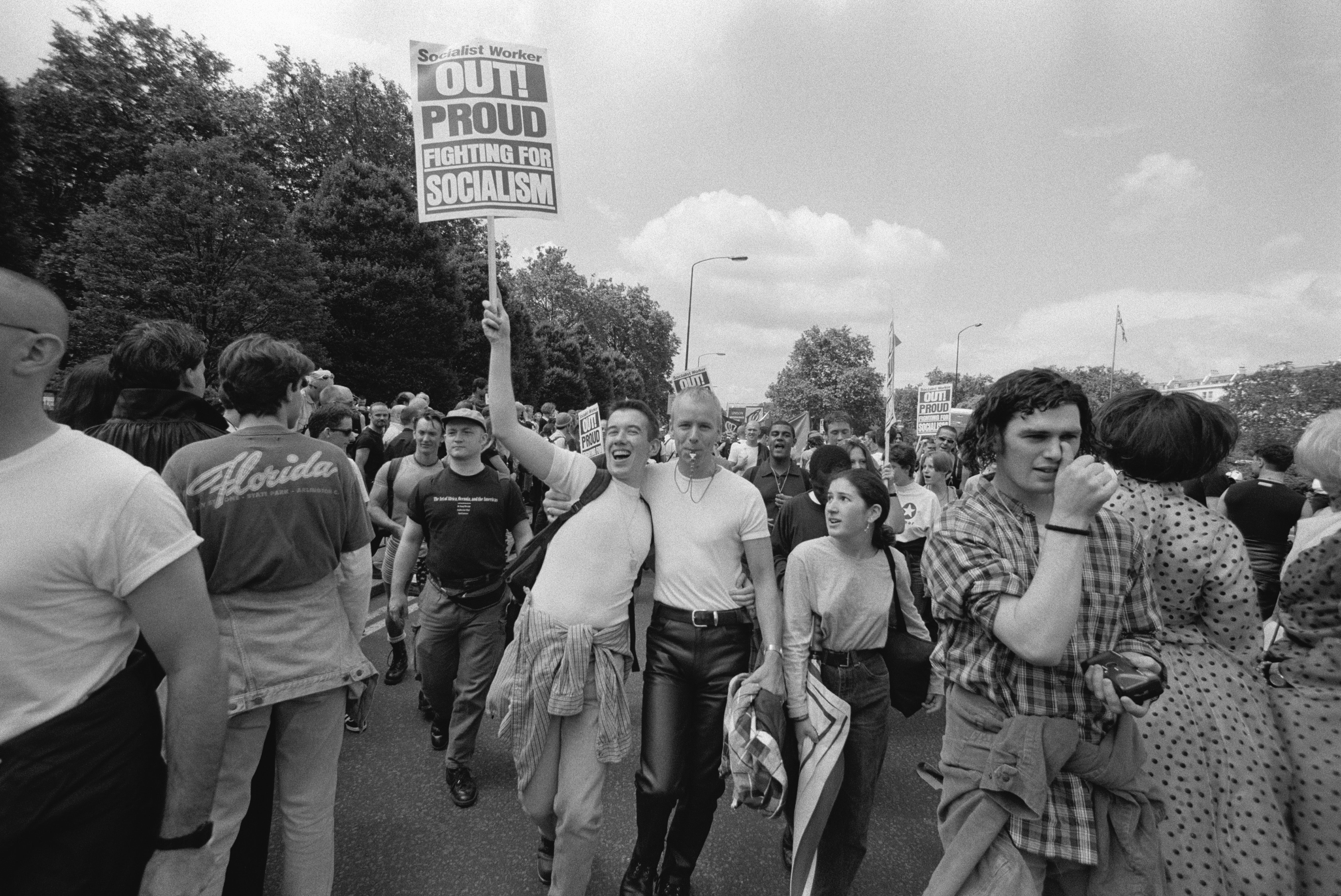 Two supporters of the Socialist Workers Party among the marchers at a Gay Pride Parade in London in July 1996