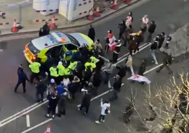 <p>Police and protesters in Westminster clashed as officers used a police vehicle to escort Labour leader Sir Keir Starmer to safety (Conor Noon/PA/screen grab)</p>