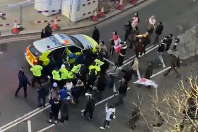<p>Police and protesters in Westminster clashed as officers used a police vehicle to escort Labour leader Sir Keir Starmer to safety (Conor Noon/PA/screen grab)</p>