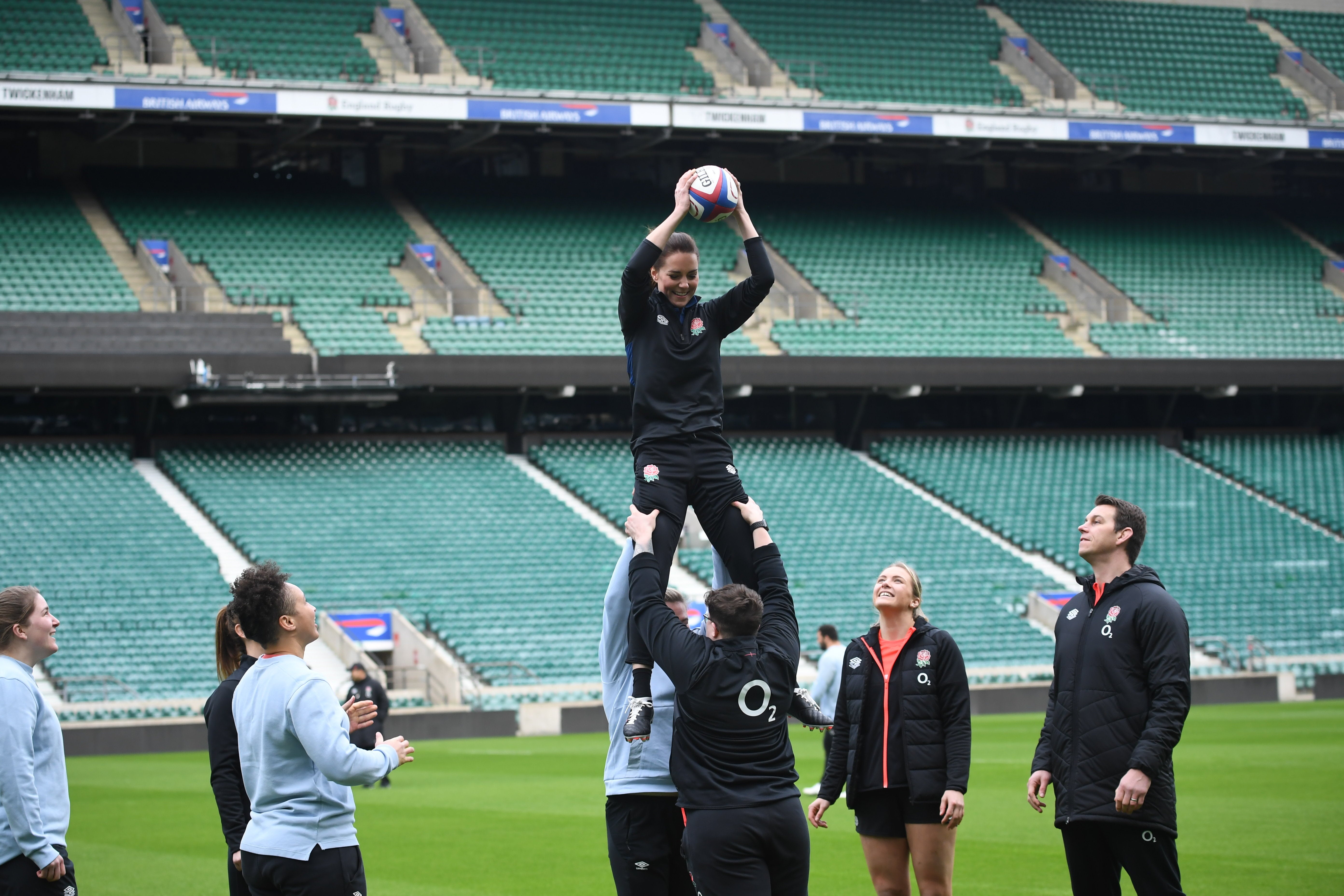 The Duchess of Cambridge is lifted up in a lineout as she plays rugby (Jeremy Selwyn/Evening Standard/PA)