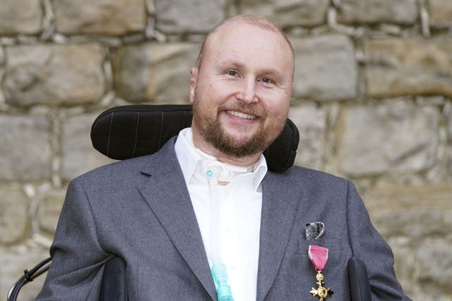 Matthew Hampson with his OBE following an investiture ceremony at Windsor Castle (Steve Parsons/PA)