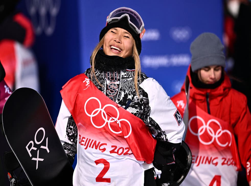 <p>USA's Chloe Kim celebrates as she wins the snowboard women's halfpipe final run during the Beijing 2022 Winter Olympic Games</p>