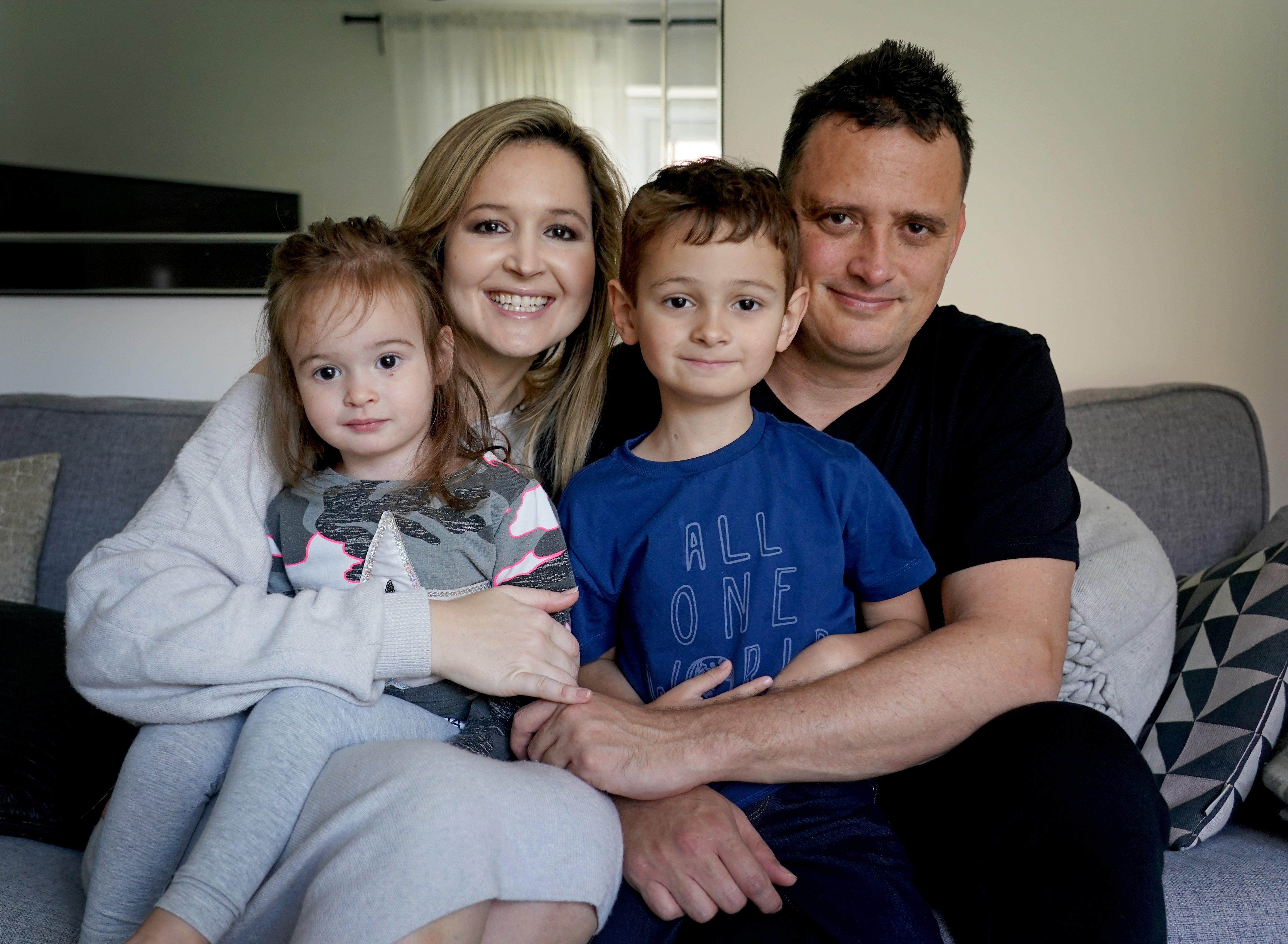 Liam Scott with his mother Claire, father Mike and sister Kylie at home in Kent. The five-year-old is cancer free after his family raised £232,000 for him to fly to New York for a cancer-vaccine not available in the UK (PA)