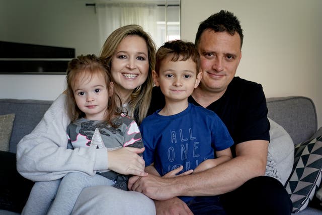 Liam Scott with his mother Claire, father Mike and sister Kylie at home in Kent. The five-year-old is cancer free after his family raised ?232,000 for him to fly to New York for a cancer-vaccine not available in the UK (PA)