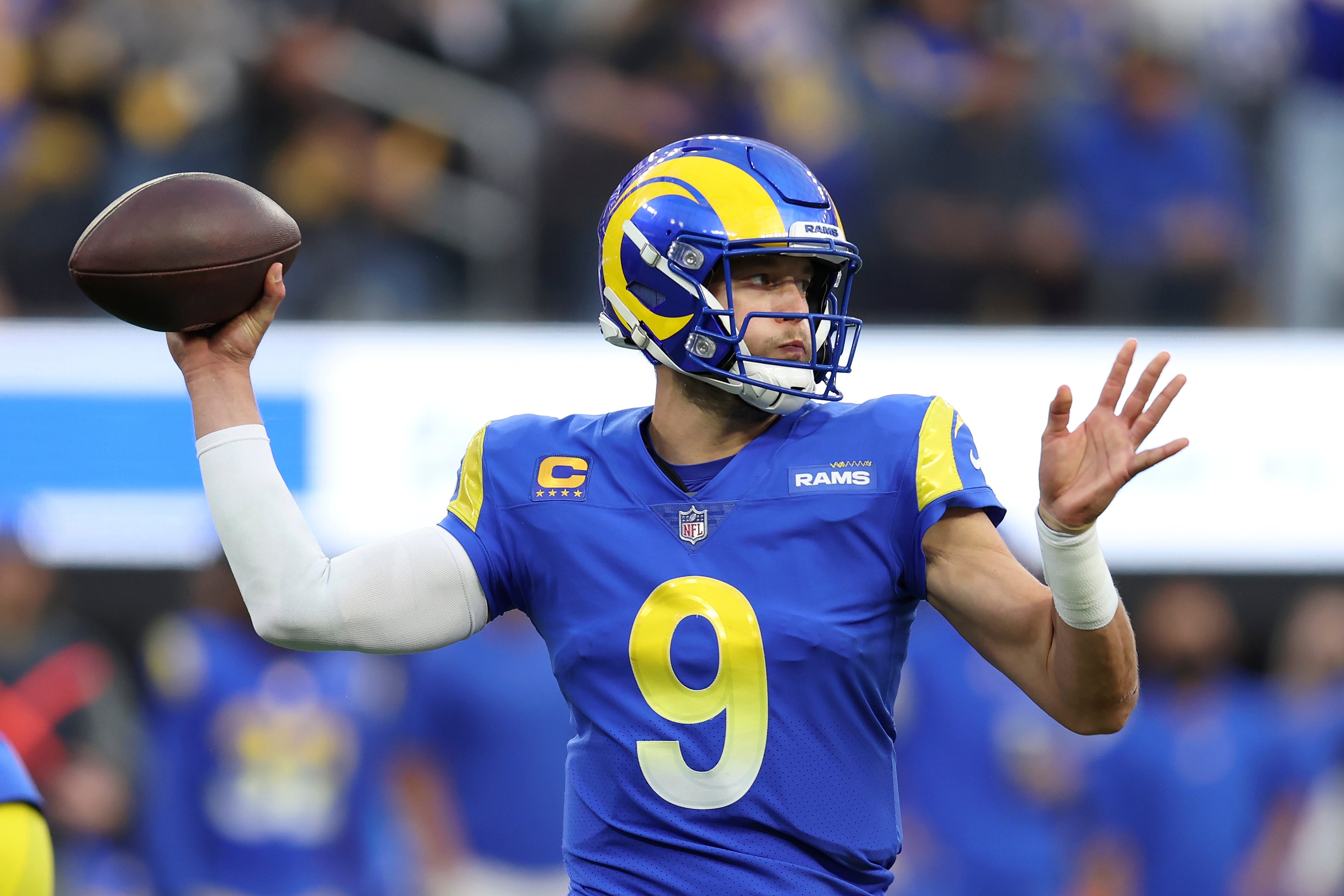 Matthew Stafford of the Los Angeles Rams hands the Vince Lombardi