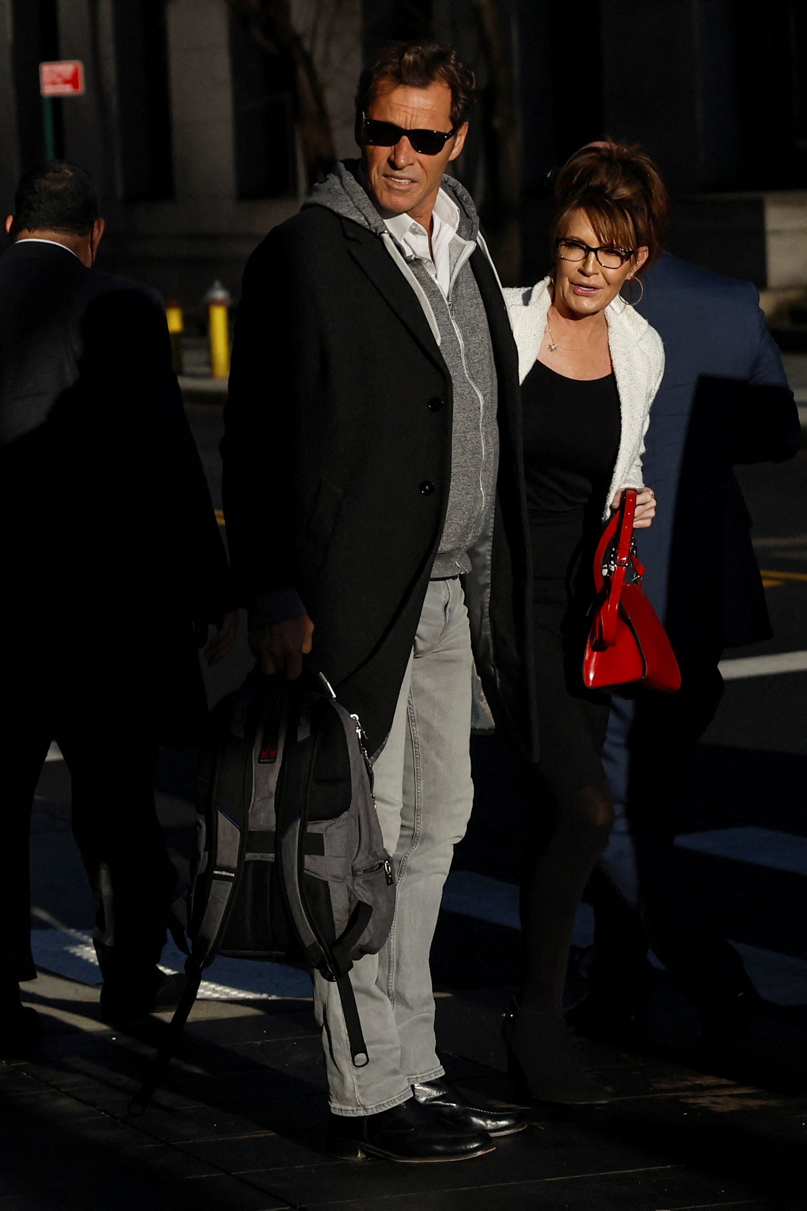 Sarah Palin arrives with former NHL hockey player Ron Duguay during her defamation lawsuit against the New York Times, at the United States Courthouse in Manhattan on 10 February 2022