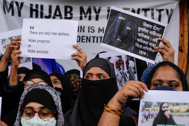 <p>Indian muslims hold placards demanding their right to wear hijabs to college</p>