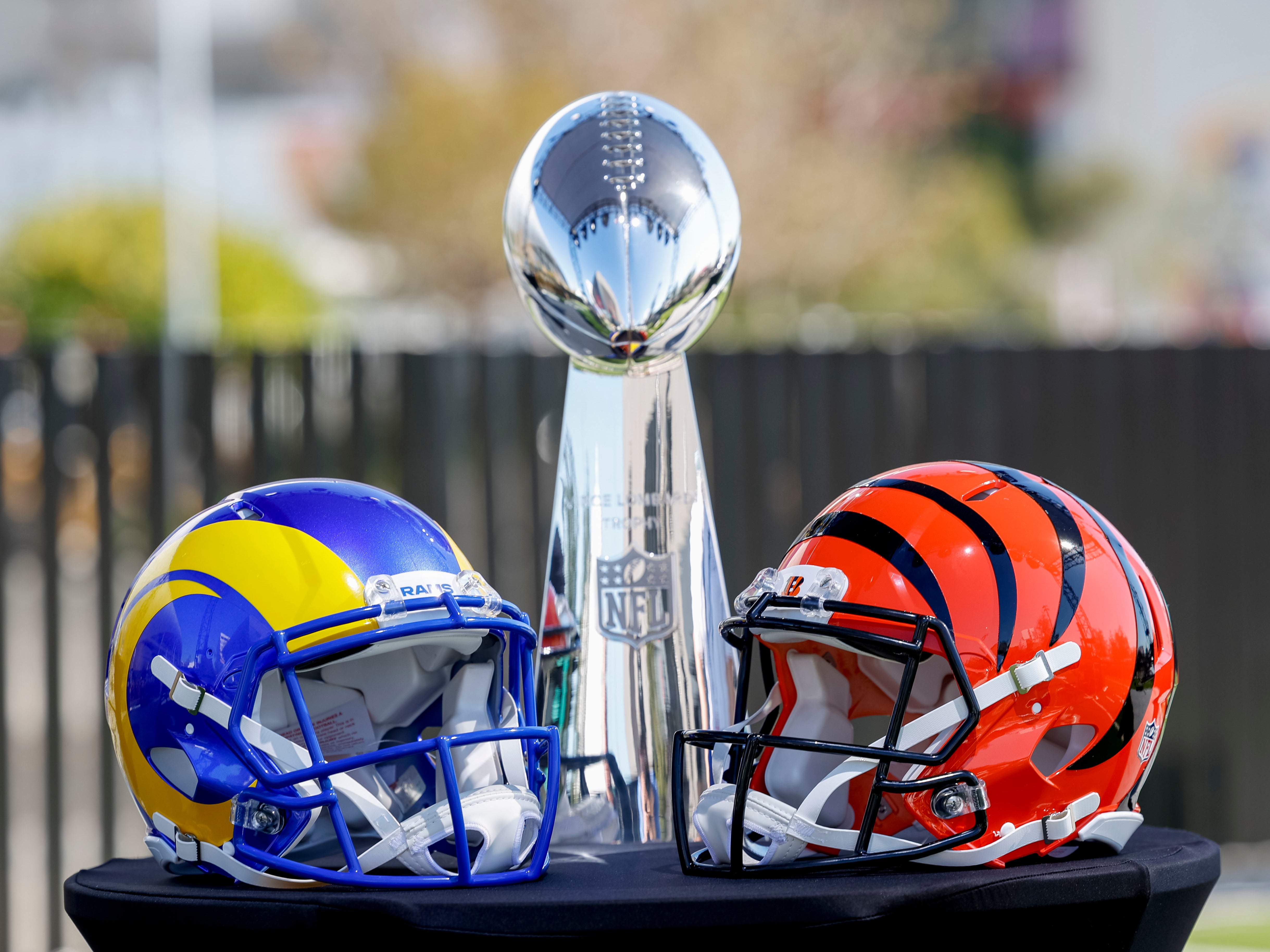 The Los Angeles Rams’ and the Cincinnati Bengals’ helmets sit in front of the Vince Lombardi Trophy