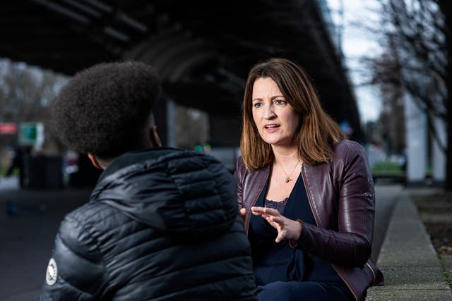 <p>Jo Rice, chief executive and founder of Resurgo, pictured in conversation with a trainee near their west London offices</p>