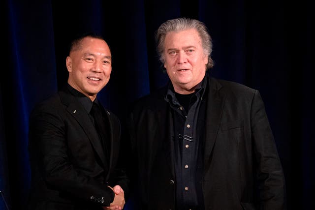 <p>Former White House Chief Strategist Steve Bannon (R) greets fugitive Chinese billionaire Guo Wengui before introducing him at a news conference on November 20, 2018 in New York</p>