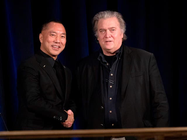 <p>Former White House Chief Strategist Steve Bannon (R) greets fugitive Chinese billionaire Guo Wengui before introducing him at a news conference on November 20, 2018 in New York</p>