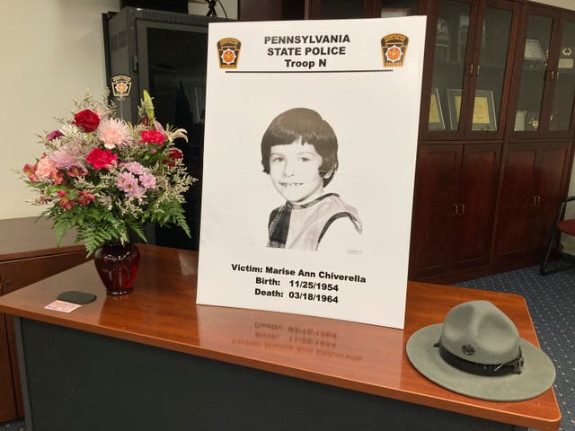 <p>A poster of Marise Ann Chiverella is displayed with a vase of flowers and a trooper's hat at a Pennsylvania State Police news conference in Hazleton, Pennsylvania  </p>