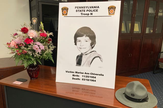 <p>A poster of Marise Ann Chiverella is displayed with a vase of flowers and a trooper's hat at a Pennsylvania State Police news conference in Hazleton, Pennsylvania  </p>