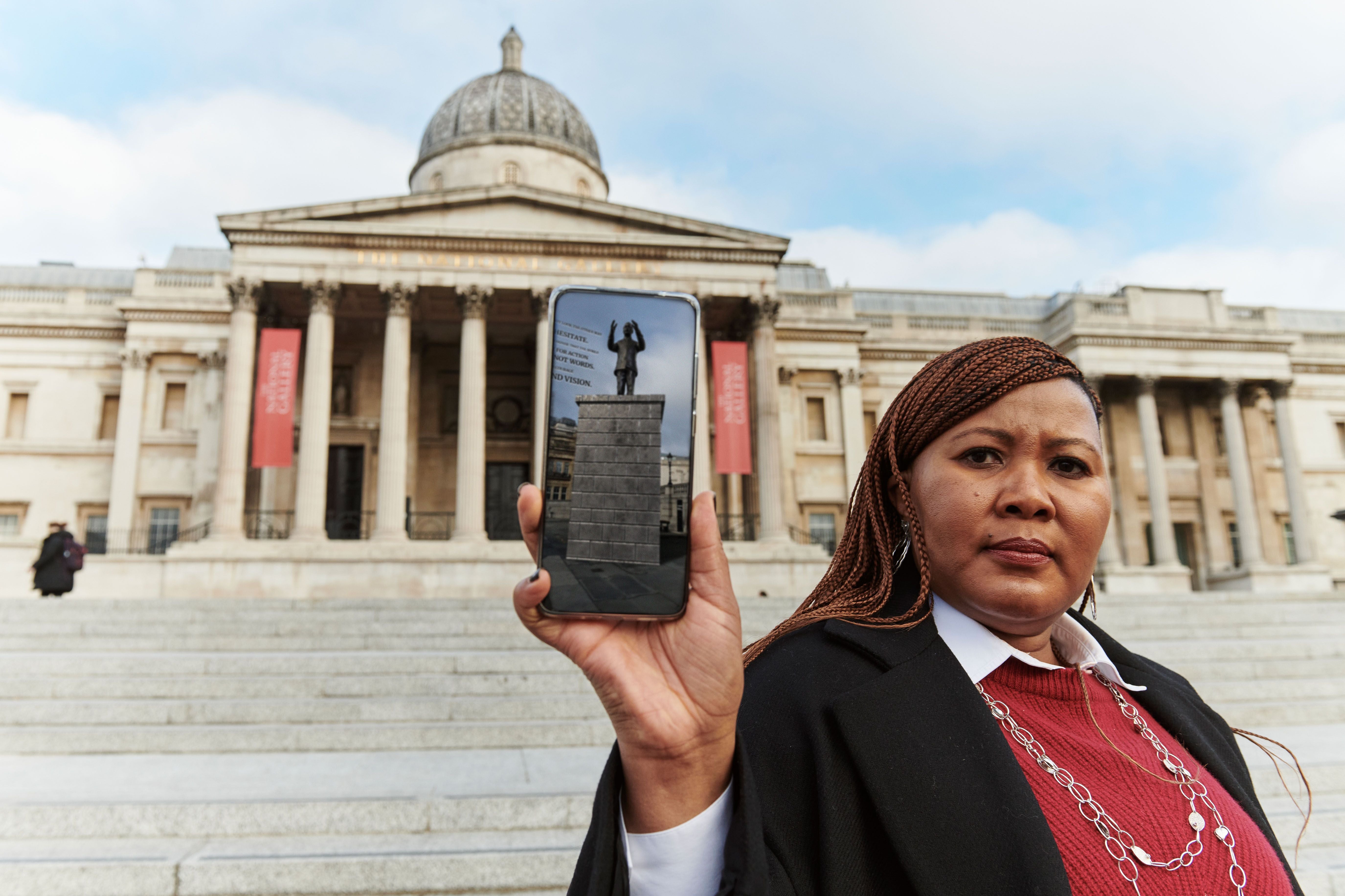 Tukwini Mandela displays a photo of her grandfather’s statue as part of Snapchat’s Hidden Black Stories augmented reality project