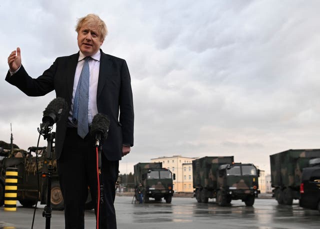 <p>Boris Johnson talks to the media at a military base in Poland last week </p>