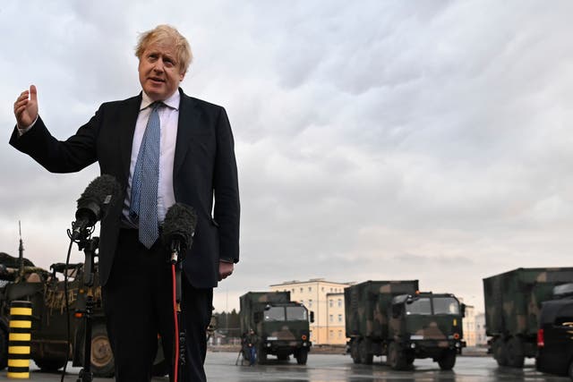 <p>Boris Johnson talks to the media at a military base in Poland last week </p>