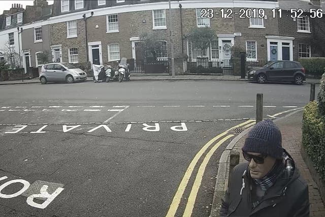 <p>Anis Hemissi, 24, wearing a latex mask and sunglasses litter on the junction of Battersea Church Road and Paveley Driveon.</p>