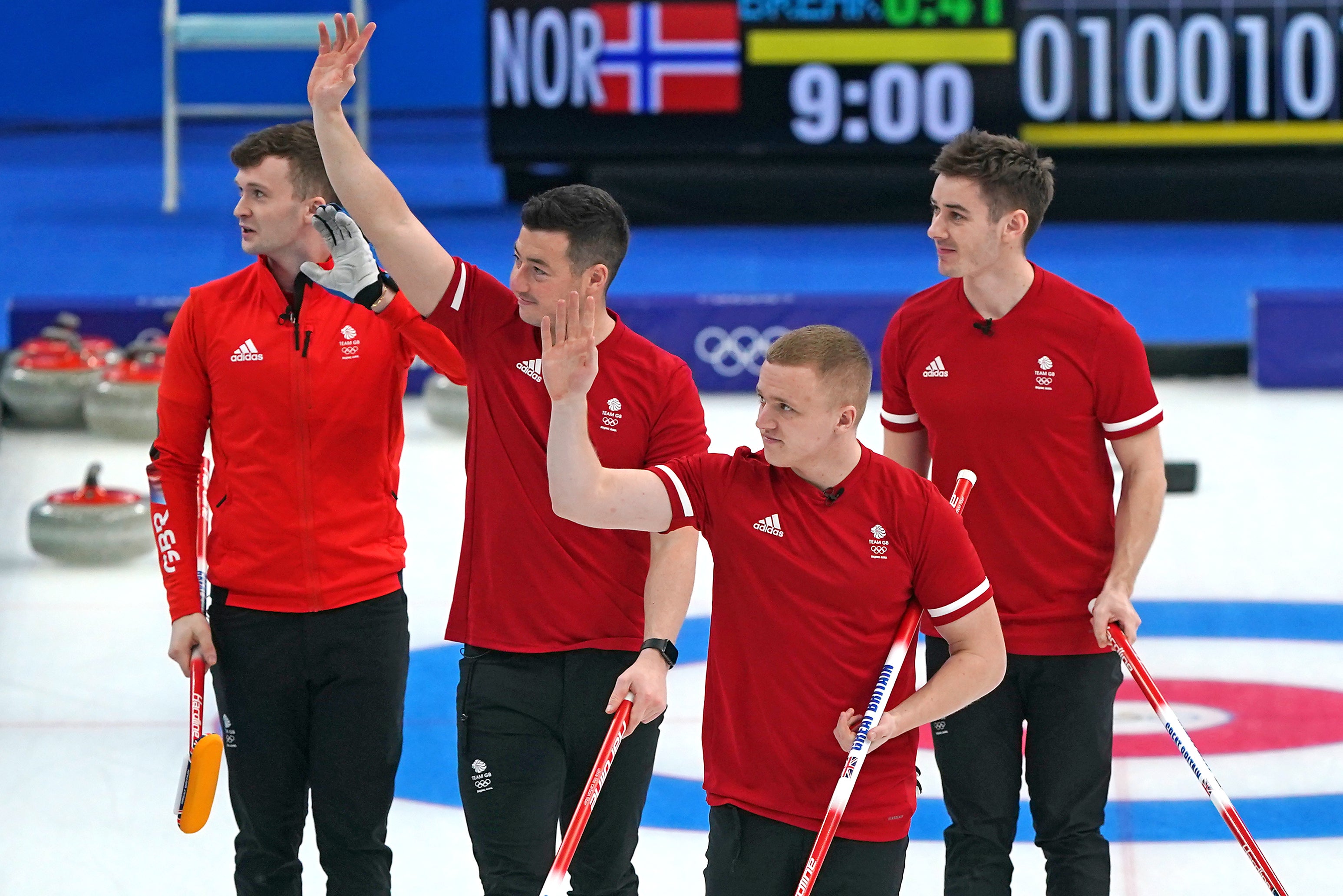 Great Britain’s men curlers celebrate an impressive round-robin competition victory over Norway (Andrew Milligan/PA)