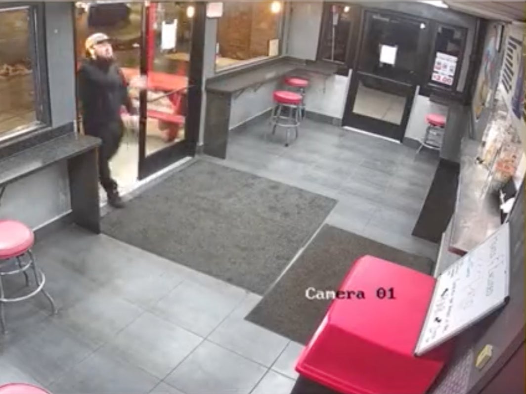 A man was caught on video camera throwing snow at employees