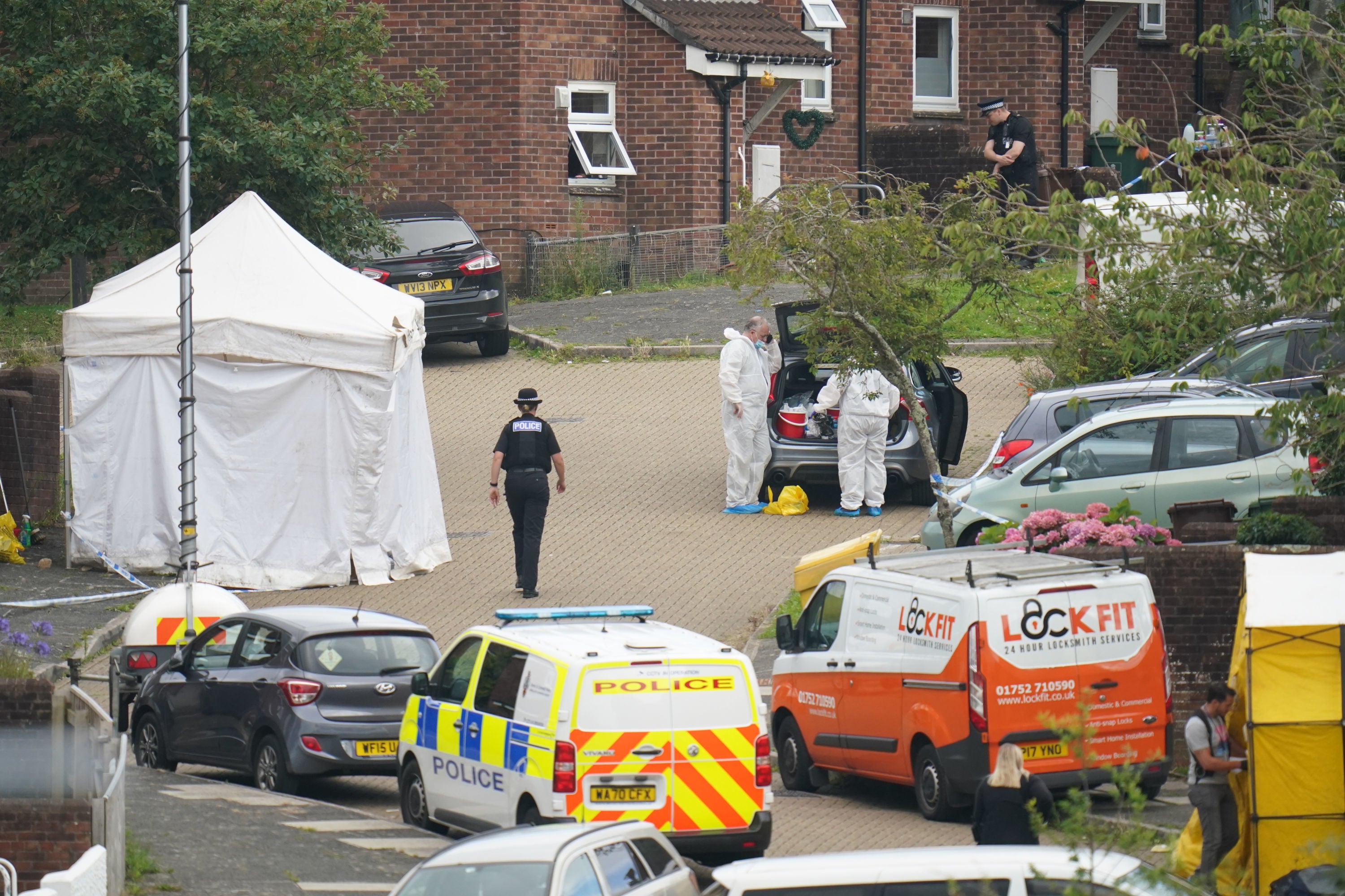 Police and forensic officers at the scene in Biddick Drive, Keyham, Plymouth