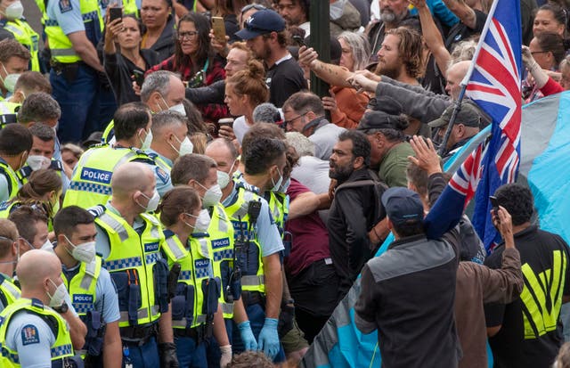 <p>Police arrest people protesting against coronavirus mandates at Parliament in Wellington, New Zealand, on 10 Feb 2022 </p>
