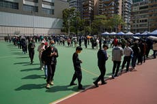 Hong Kong reports record COVID-19 cases, tightens measures