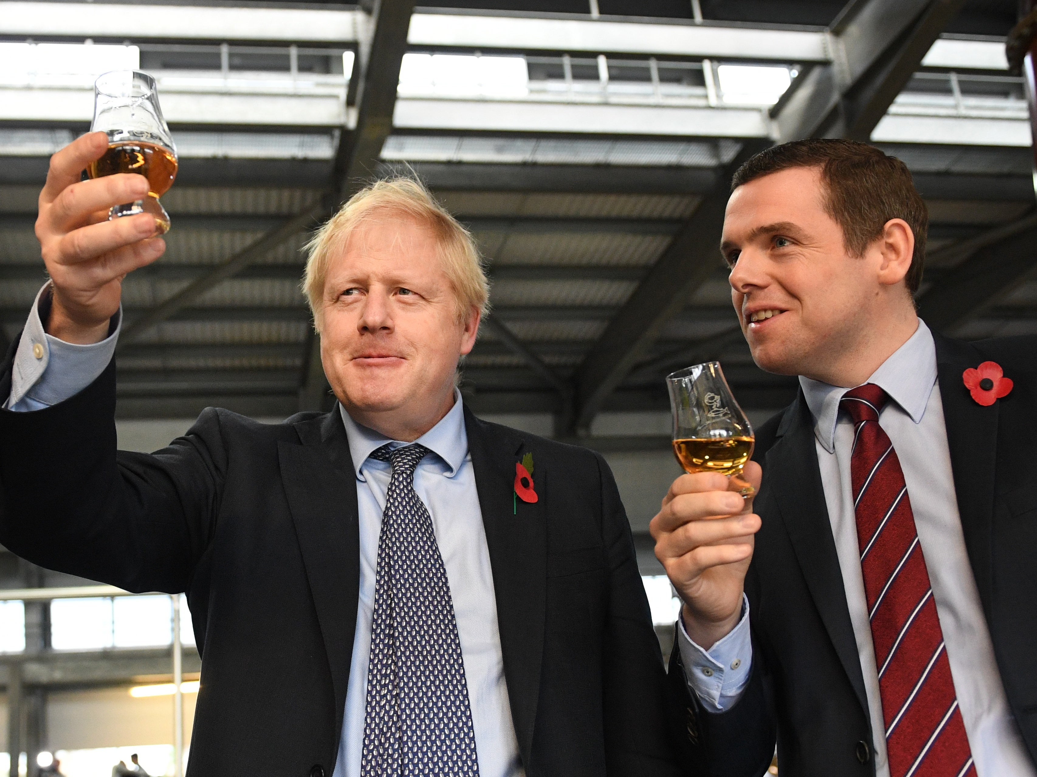Boris Johnson with Douglas Ross on a distillery tour during the 2019 general election campaign (PA)
