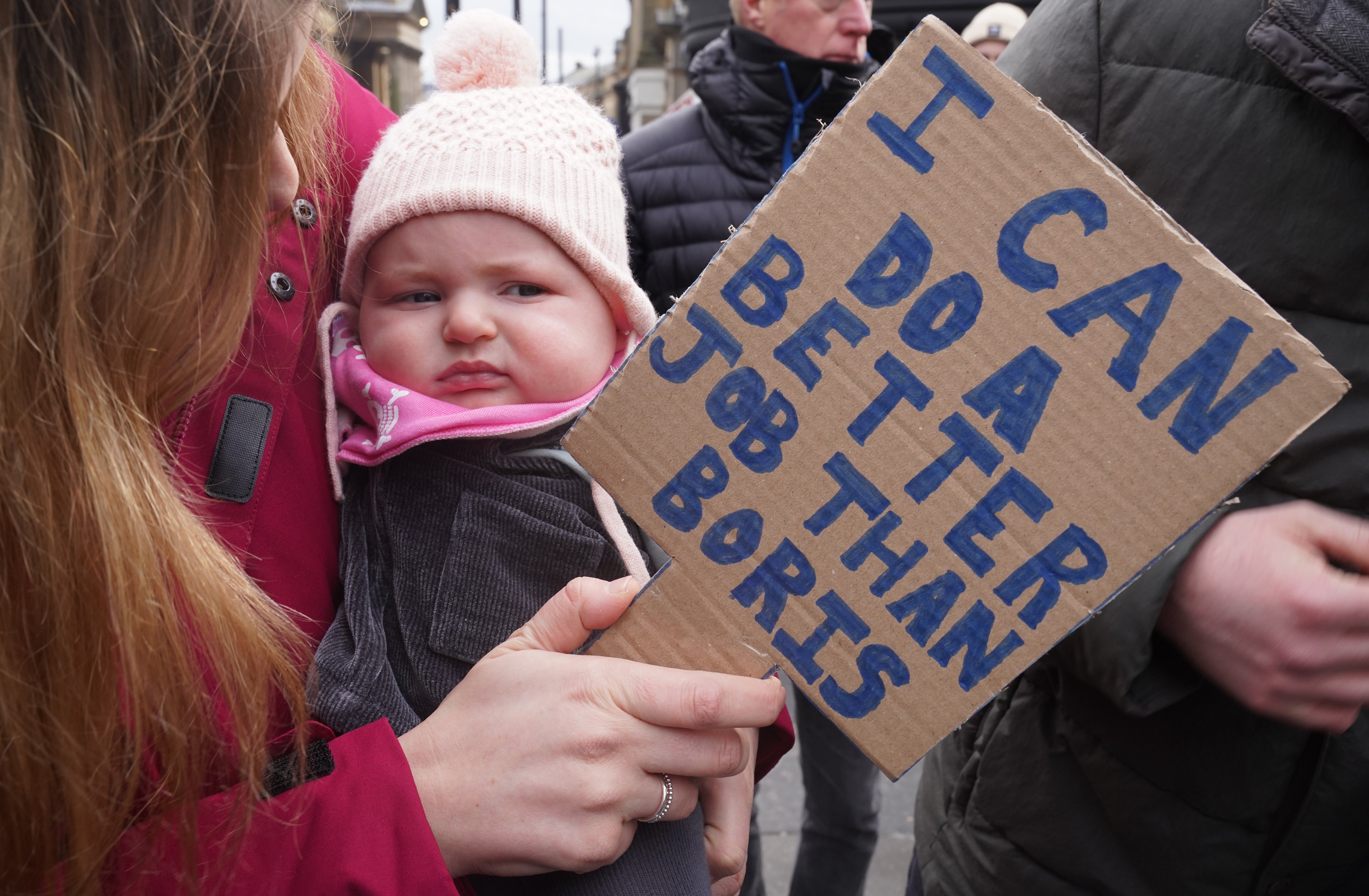 Three-month-old Jocelyn Wilczek joins people in Newcastle taking part in the People’s Assembly nationwide protest about cost of living crisis (Owen Humphreys/PA)