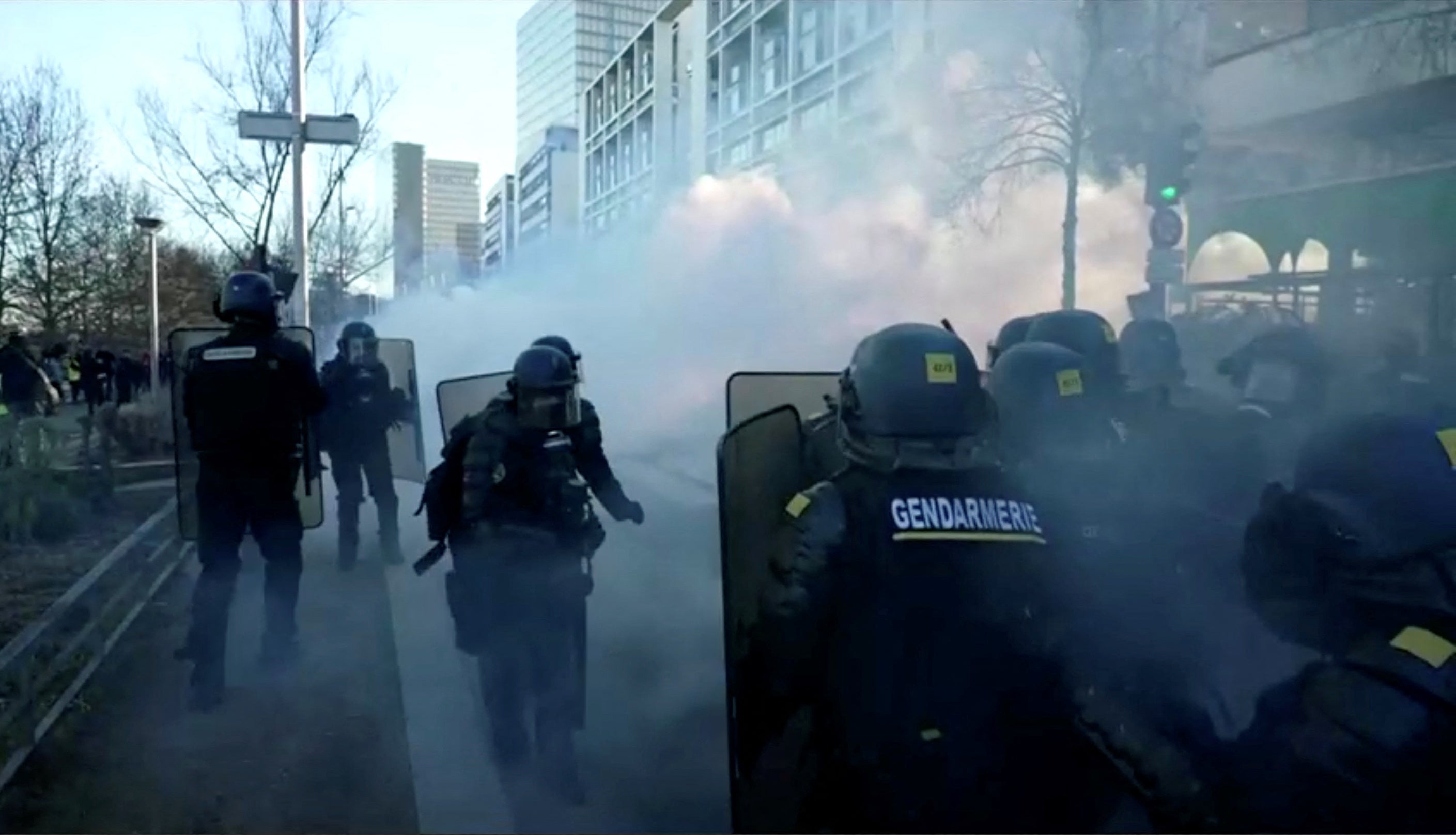 French police use tear gas while facing demonstrators