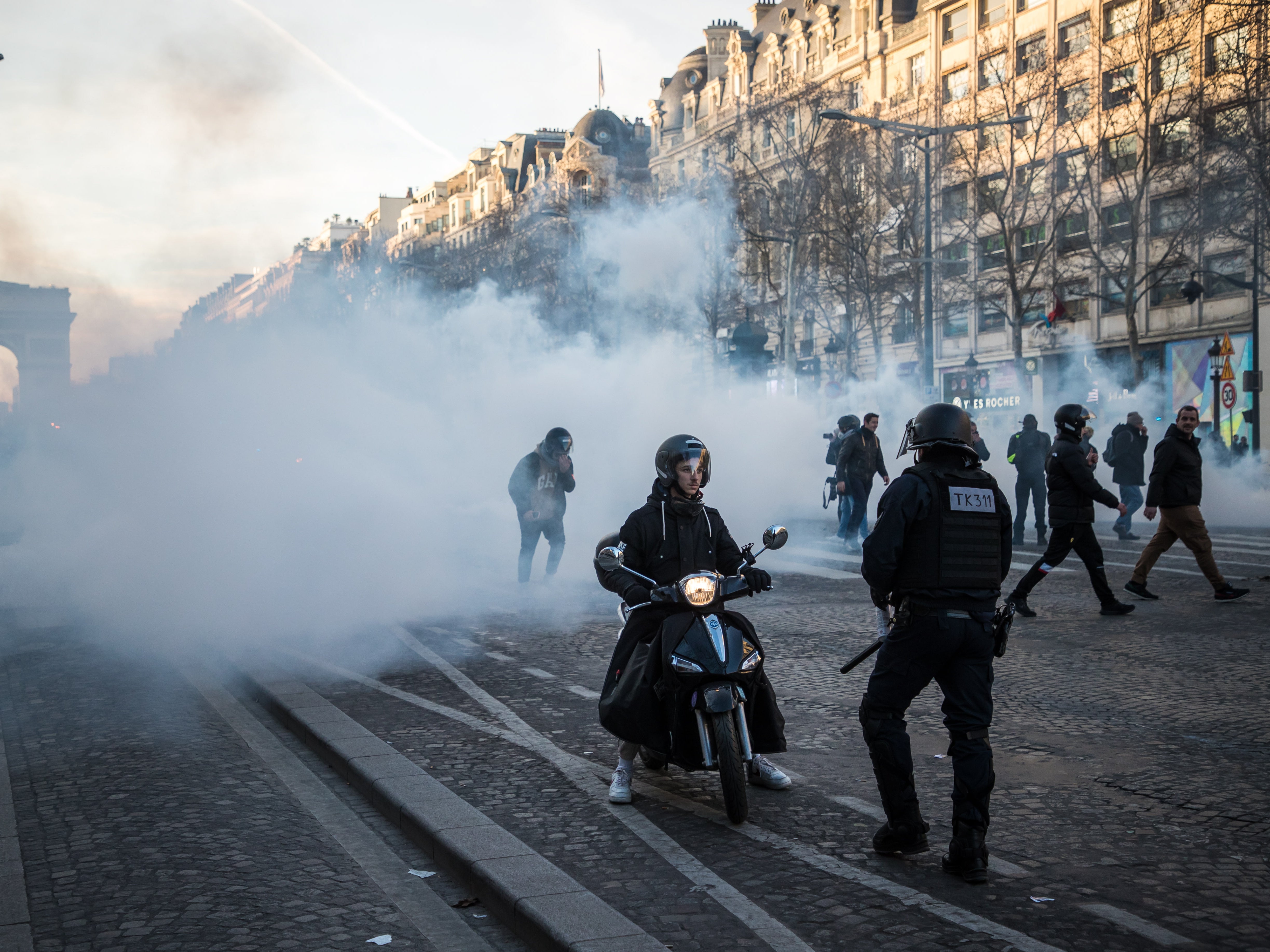 Tear gas on the streets of Paris as protesters defy government ban