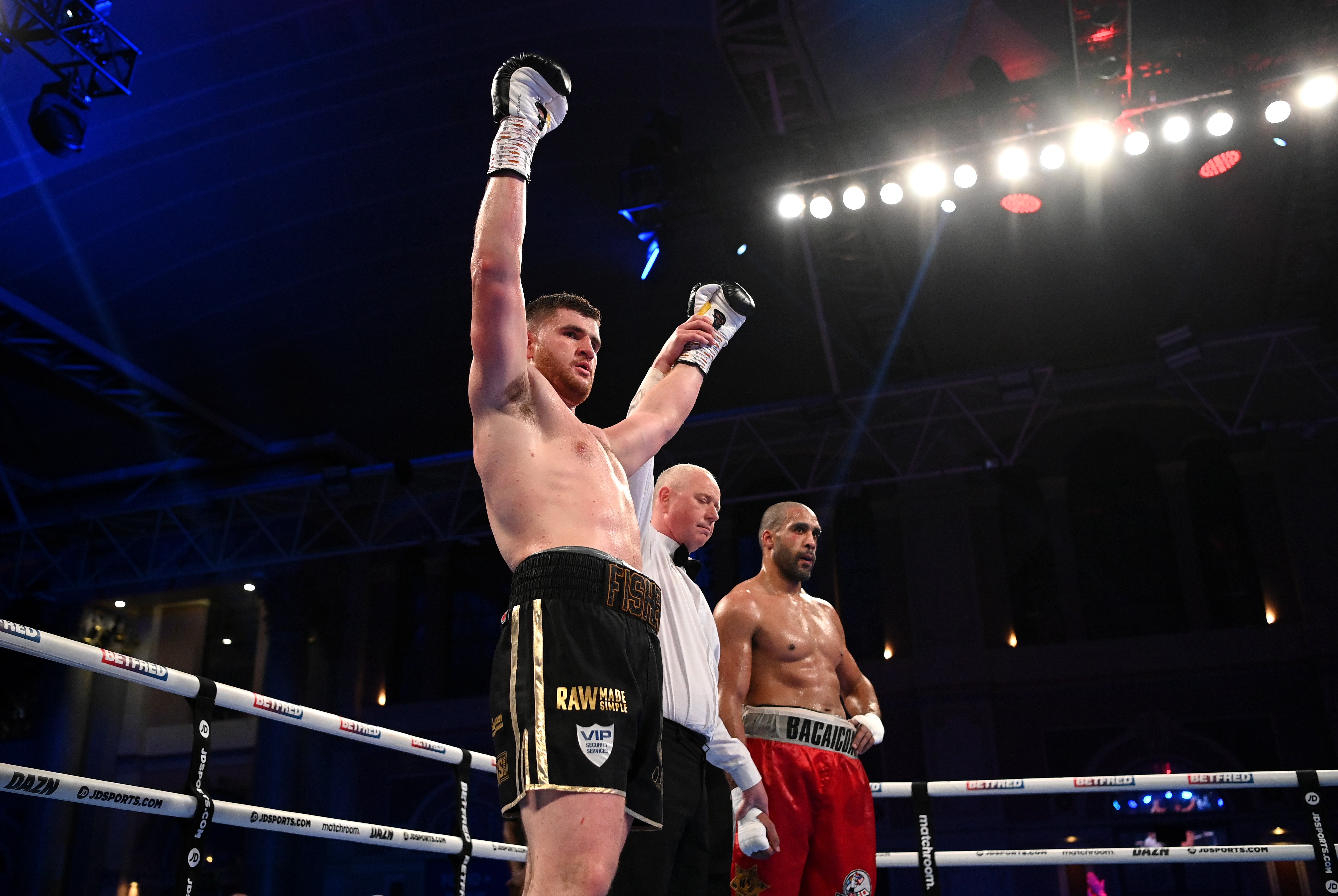 Johnny Fisher celebrates his points victory over Gabriel Enguema