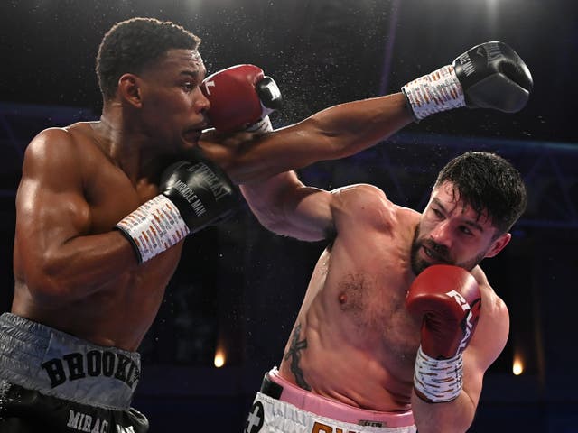 <p>John Ryder (right) secured a controversial split-decision win against Daniel Jacobs</p>