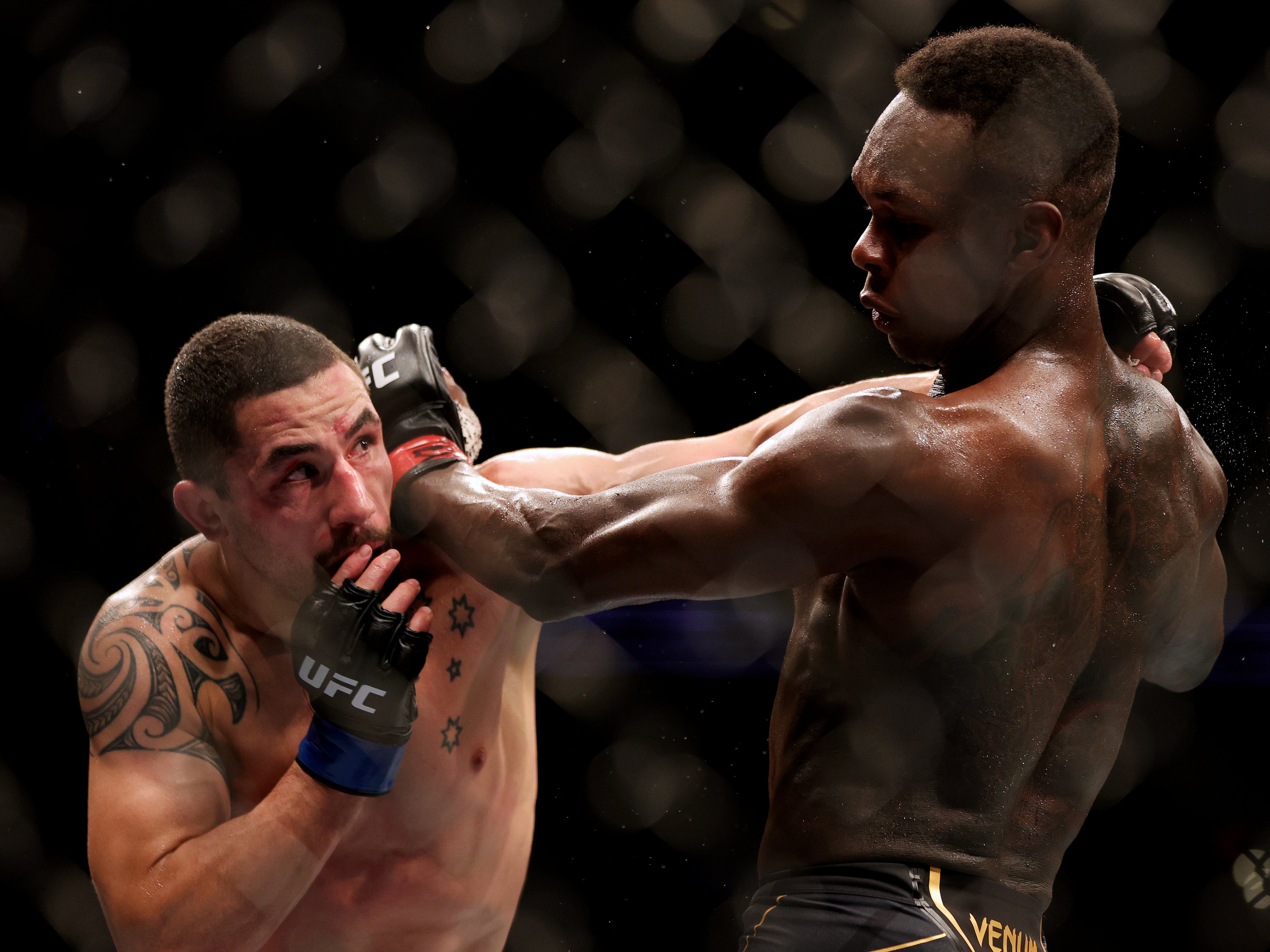 Israel Adesanya (right) again beat Robert Whittaker, this time on points