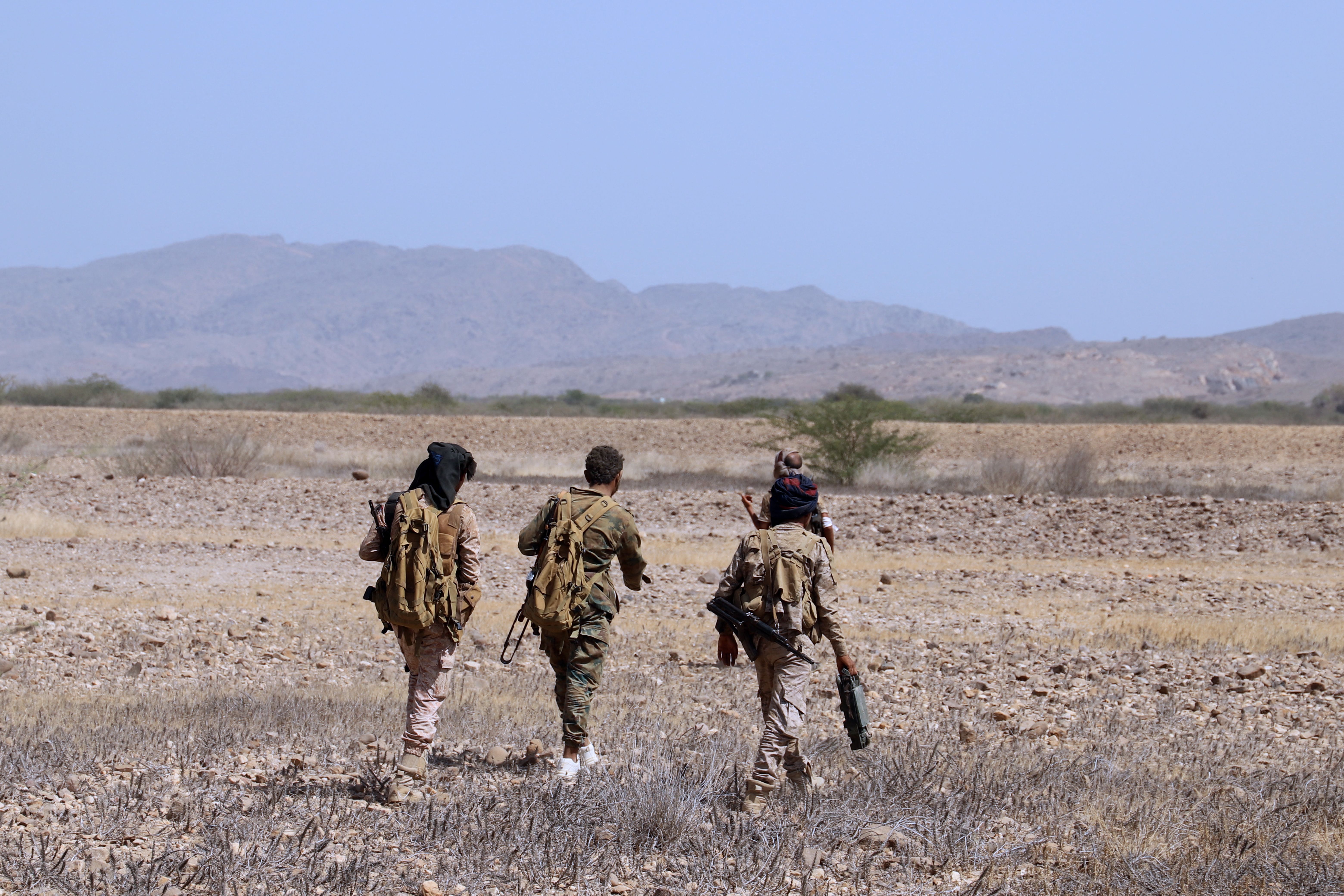 File: Yemeni pro-government fighters man a position near al-Muhsam camp during fighting to drive the pro-Iran Houthi rebels from the area of Harad, in Yemen