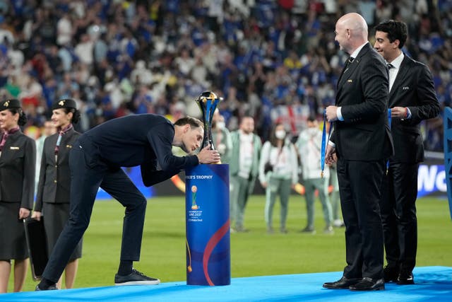 Thomas Tuchel kissed the Club World Cup trophy after Chelsea’s win (Hassan Ammar/AP)